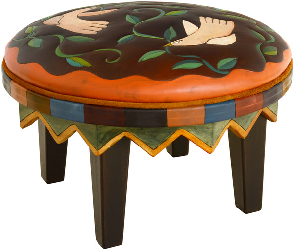 Round Ottoman –  Handsome ottoman in a classic palette with birds and twisting vines artwork main view