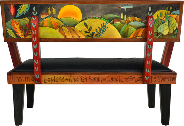 Loveseat with Leather Seat –  Beautiful loveseat with hand stitched block and heart pattern and rolling landscape on the back