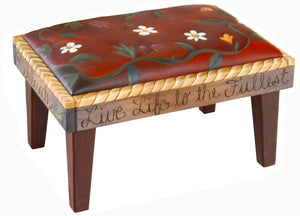 Ottoman –  Lovely red "live life to the fullest" ottoman with a floral vine and rope border edge main view