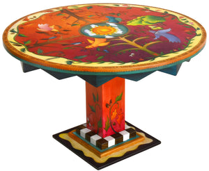 Sticks handmade dining table with vibrant folk art imagery