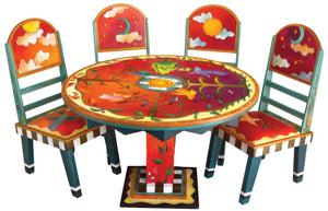 Sticks handmade dining table with vibrant folk art imagery and matching chairs