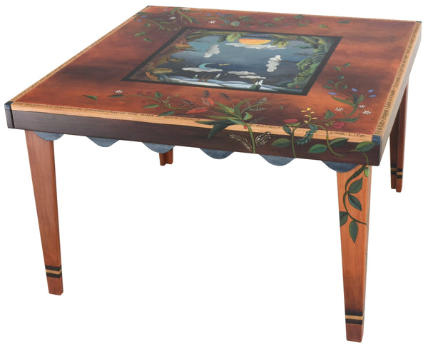 Square Dining Table –  "Make Each Moment Count" dining table with sun and moon over scenes of the changing seasons motif