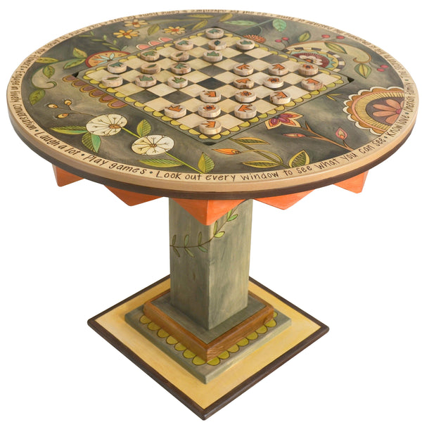 Flip-Top Game Table –  "Go Out for Adventure/Come Home for Love" flip-top game table with checkerboard surrounded by beautiful floral motif