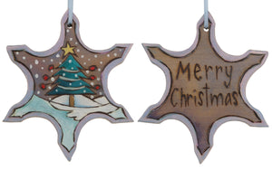 Snowflake Ornament –  "Merry Christmas" snowflake ornament with Christmas tree in the snow motif