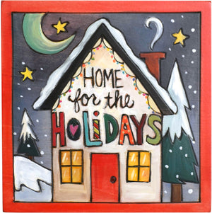 Sticks handmade wall plaque with "Home for the Holidays" quote and colorful house lit with Christmas lights