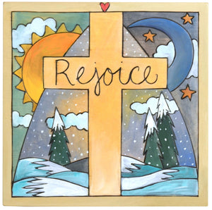 Sticks handmade wall plaque with "Rejoice" quote and cross on a snowy winter landscape