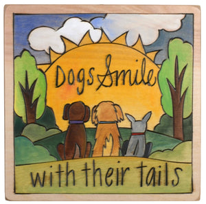 Sticks handmade wall plaque with "Dogs Smile with their tails" quote and dogs in front of a sun imagery