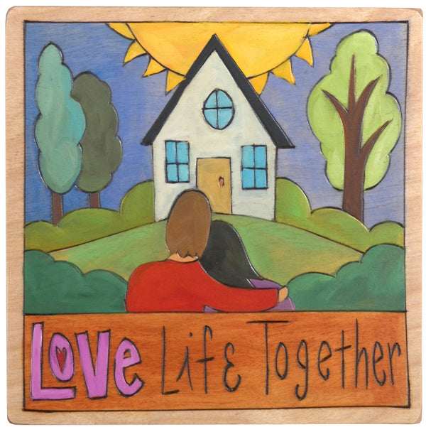 Sticks handmade wall plaque with "Love Life Together" quote and couple in front of their home imagery