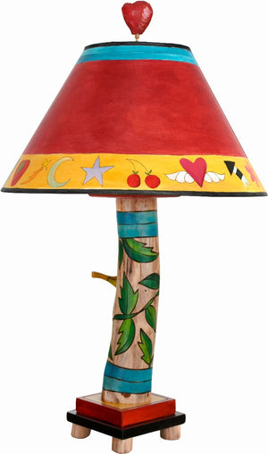 Log Table Lamp –  Colorful and vibrant table lamp with vine motifs and bird element