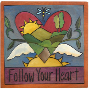 Sticks handmade wall plaque with "Follow your heart" quote and heart with wings imagery