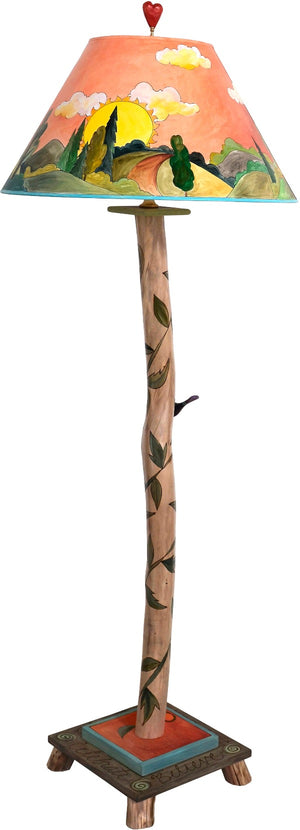 Log Floor Lamp –  Sun and moon themed landscape lamp with vine motifs