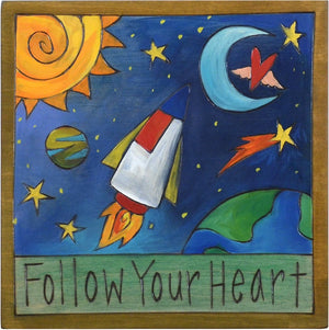 Sticks handmade wall plaque with "Follow your heart" quote and rocket into space imagery
