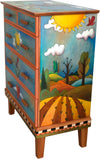 Tall Dresser –  This predominately blue dresser features a tree of life in the landscape design