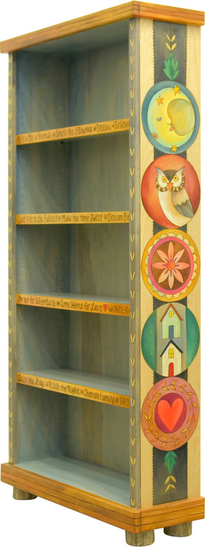 Tall Bookcase –  Light and airy bookcase with large encircled icons motif