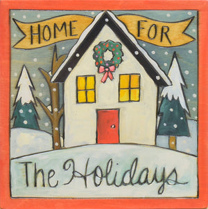"Home for the holidays" plaque with a cute house adorned with a wreath
