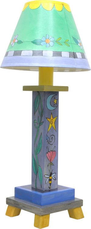 Milled Candlestick Lamp –  Cool-toned stacked icon lamp base motif with a sweet shade filled with flowers and scallops