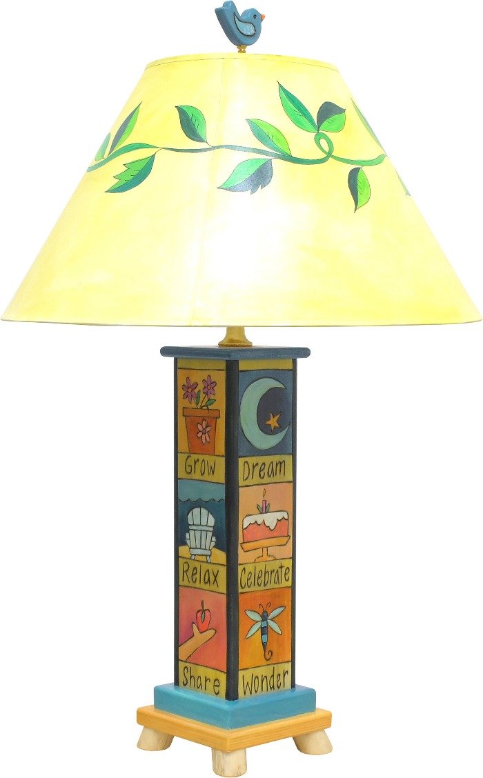 Fun and folky table lamp with vine-wrapped shade, bird finial, and base with cute boxed icons and coordinating phrases, back view