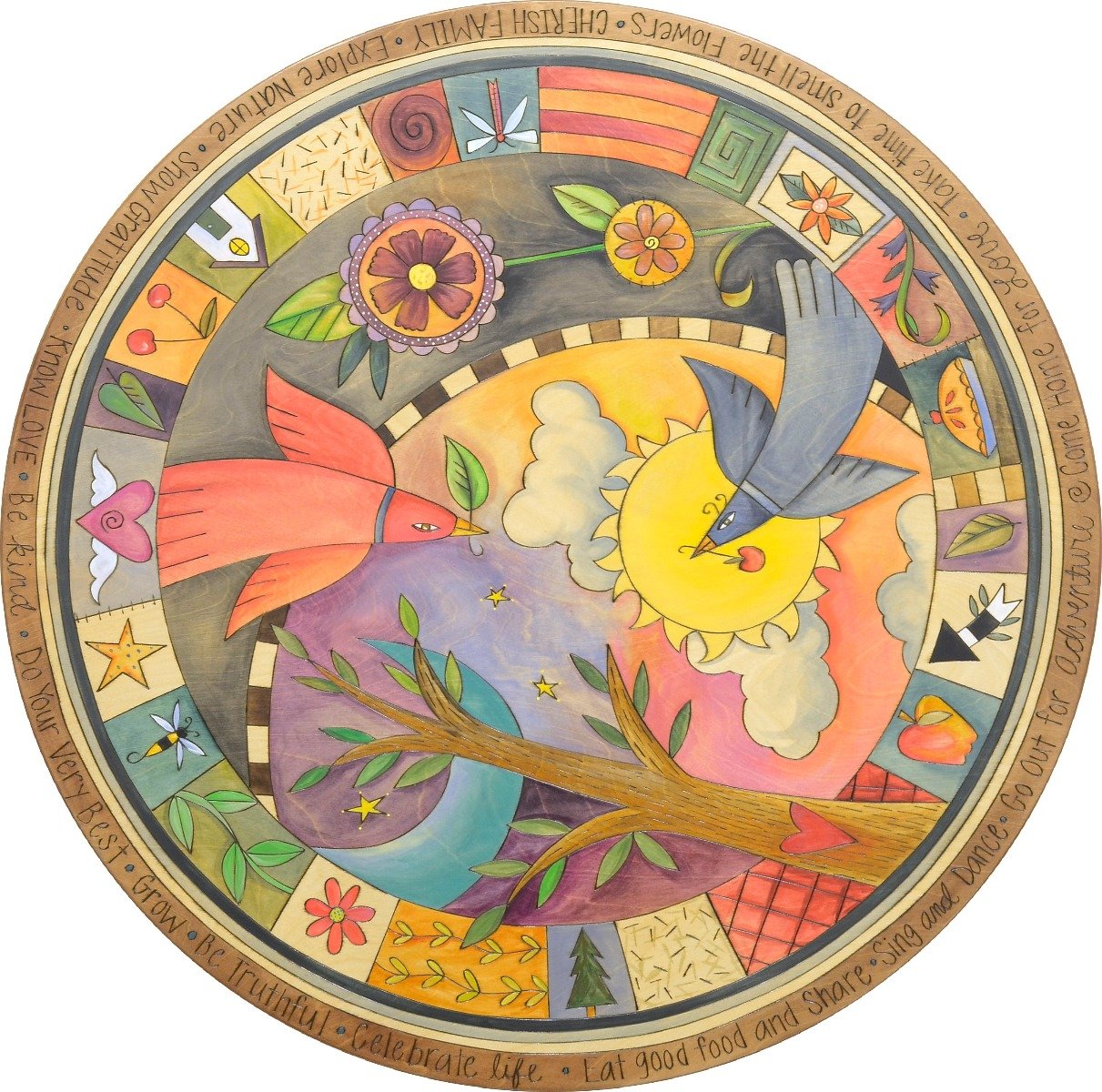 Birds fly by a tree of life encircled in boxed icons tabletop motif