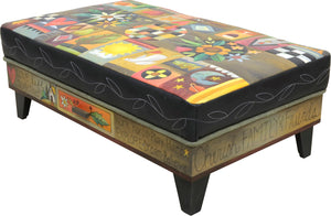 Crazy quilt ottoman motif with center floral sprays and a contrasting stitched vine around its edge