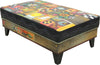 Crazy quilt ottoman motif with center floral sprays and a contrasting stitched vine around its edge