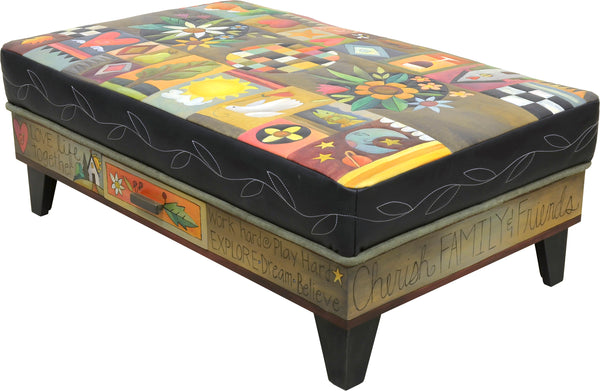 Crazy quilt ottoman motif with center floral sprays and a contrasting stitched vine around its edge