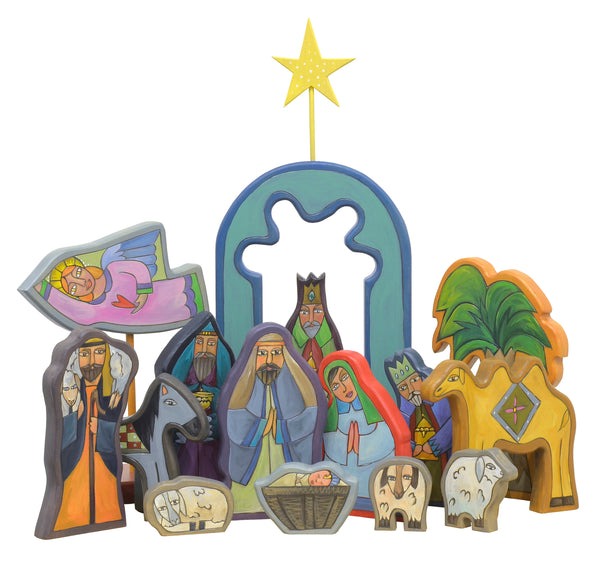 Nativity sculpture done in a vibrant palette predominately in blue tones