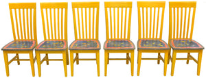 Understated, colorful chair set with vine motifs on the seats