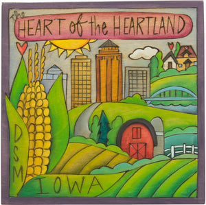 "The Heart of the Heartland" Des Moines Iowa themed plaque nestled into a rural landscape
