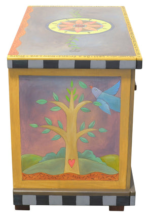 Small Dresser –  Eclectic dresser with boxed icon drawer fronts, tree of life scenes on sides, and flower medallion on top left view