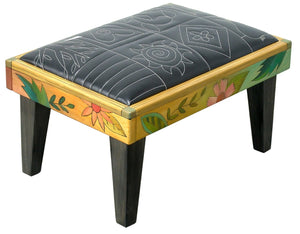 Friedrich's Chair and Matching Ottoman – Black and white floral leather seat and patchwork ottoman design, with coordinating colorful patchwork design filling the back of the oversized chair ottoman back view