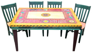 Rectangular Dining Table – Bold, bright, and beautiful design inspired by papel picado Mexican folk art with elaborate scallops, block letter phrases, and Sticks icons staged with four chairs