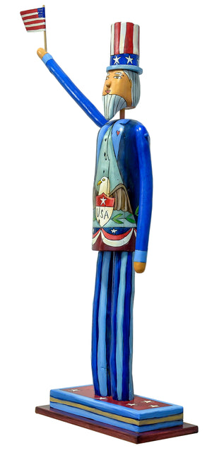 Medium Uncle Sam Sculpture – Sam dressed in a blue suit with a bald eagle emblem on his front and American landscape filled heart on his back side view