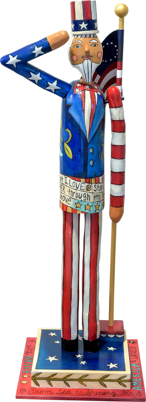 Large Uncle Sam Sculpture – Saluting Uncle Sam at attention in front of a Betsy Ross flag front view