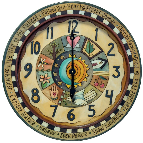 24" Round Wall Clock – Sweetly simple neutral clock with patchwork design around a celestial sun and moon center