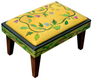 Ottoman – Classic, clean twisting vine ottoman design, both on the leather top and around the wood sides main view