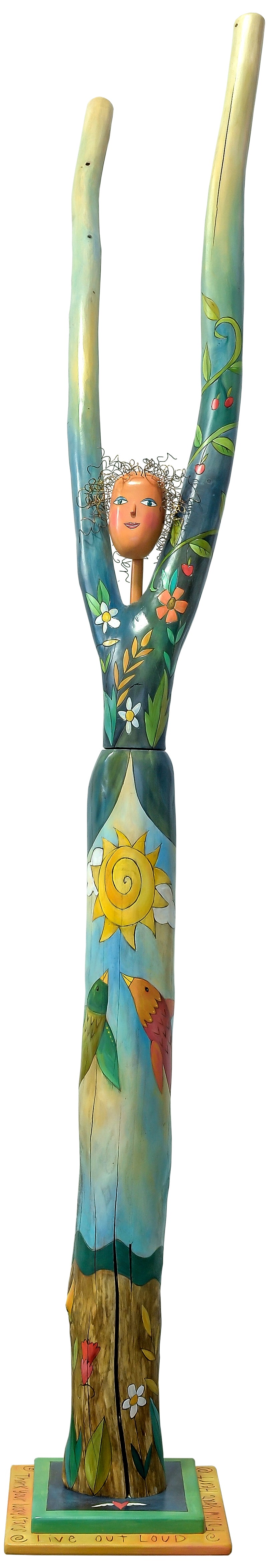 Vibrantly painted with flowers and vines wrapped around the trunk and torso combined with a sky scene. Front view.