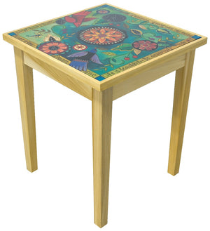 Elegant end table glass top featuring cool colors with flowers and birds surrounded by inspirational quotes. Other side view
