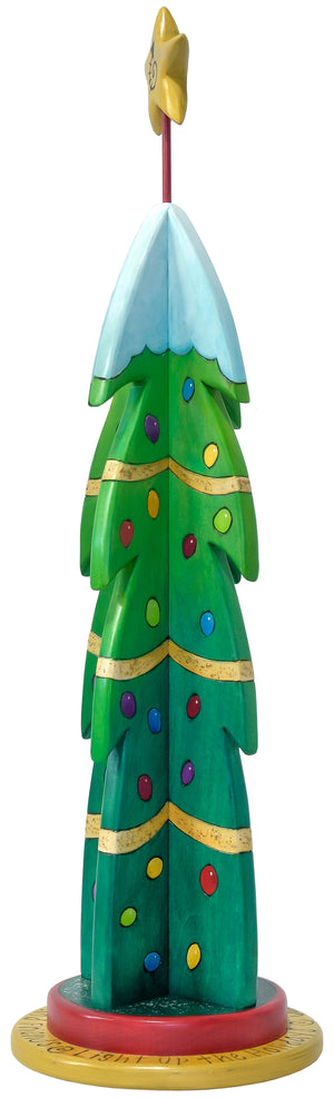Medium Christmas Tree Sculpture –  Snow-topped medium Christmas tree decorated with color ornaments and painted gold ribbon. Back