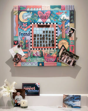 "This Sweet Life" Perpetual Calendar – Cute "follow your heart" floating icon and crazy quilt mashup motif on a canvas calendar displayed in a home's kitchen