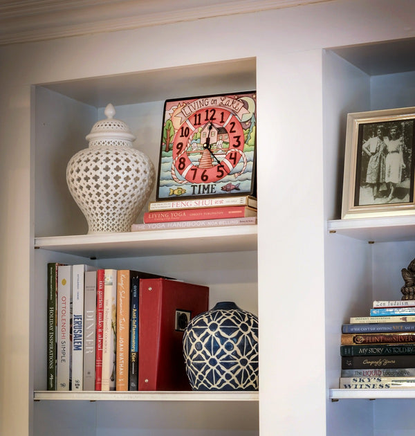 "Dock Time" Square Clock – "Living on lake time" dock and lifesaver design displayed on a shelf in a home