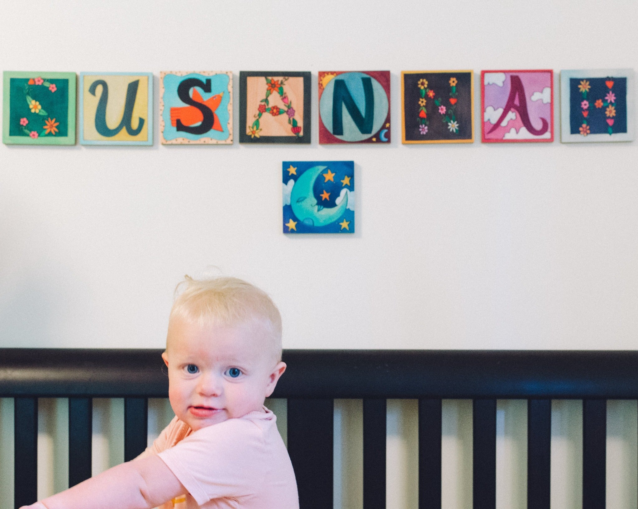 Sincerely, Sticks alphabet letter plaques to spell out the name 