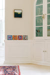 Example of Sincerely, Sticks "H" alphabet letter plaque to spell out Home