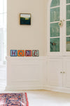 Example of Sincerely, Sticks "E" alphabet letter plaque to spell out Home