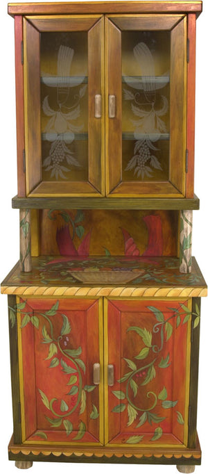 China Hutch –  Fruit vines and birds float around this china cabinet