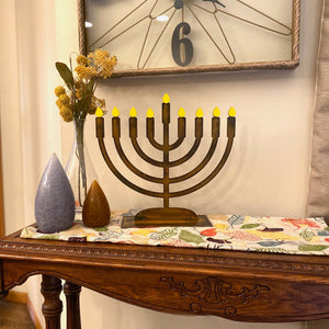 Menorah Sculpture – Dress up your home's dining table or mantle during Hanukkah with this menorah that includes little yellow candle magnets main view