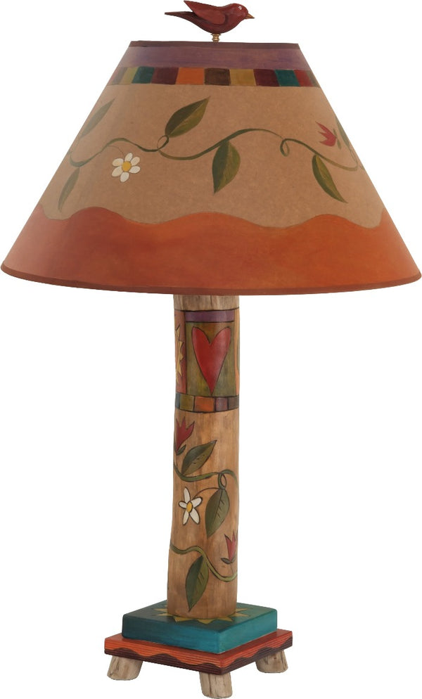 Log Table Lamp –  Elegant and neutral color palette table lamp with vine motifs and symbolic block icons