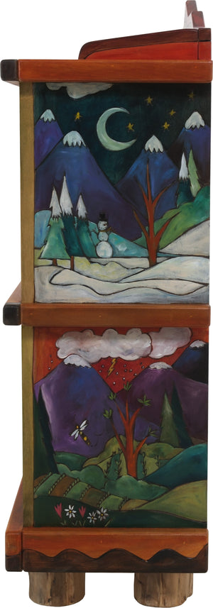 Short Bookcase –  "Go Out for Adventure/Come Home for Love" bookcase with sun and moon over snow-capped mountains motif
