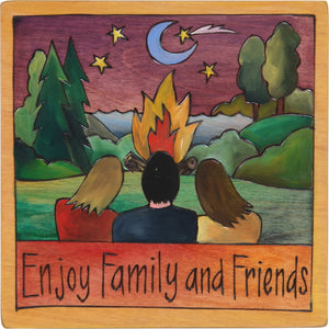 7"x7" Plaque –  "Enjoy family and friends" huddled around a lakeside bonfire
