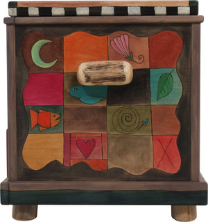 Chest with Drawer – Beautiful heart with wings floating in a landscape with a twisting vine on its lid and patchwork motifs on the sides right side view