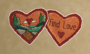 Find Love Stitch Kit Ornament –  "Find love" with a heart with wings floating through a landscape scene
